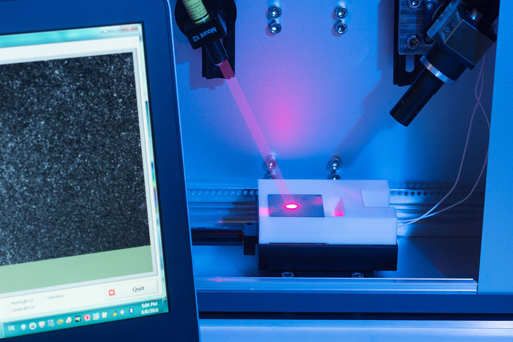 Automated in-line testing system based on laser speckle photometry.