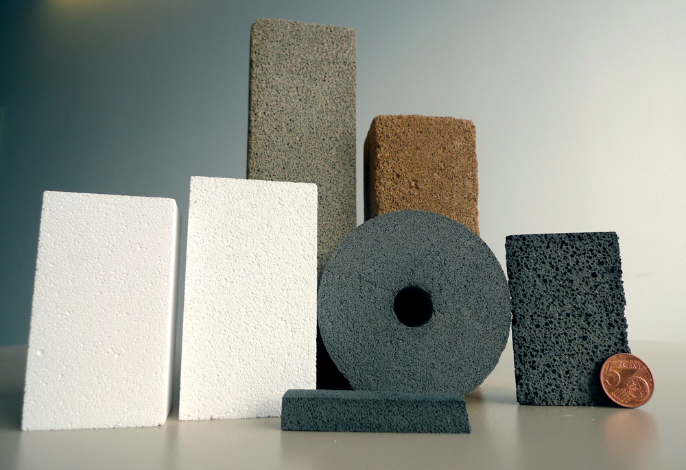 Ceramic blocks of different sizes and shades with closed porosity.